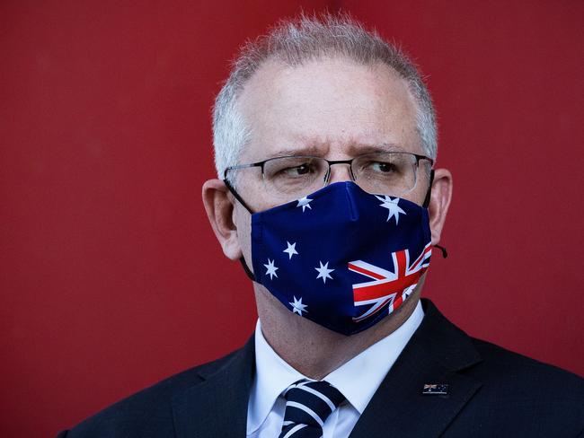 MELBOURNE, AUSTRALIA - NOVEMBER 16: Prime Minister Scott Morrison looks on during a press conference at CSL Lab where a COVID-19 Vaccine is being produced on November 16, 2020 in Melbourne, Australia. The federal government has announced a $1.8 billion agreement with pharmaceutical company CSL to construct a new biotech and vaccine manufacturing plant in Melbourne. The plant - to be the largest in the southern hemisphere - will deliver the first population-wide pandemic and seasonal flu vaccines for Australians, safeguarding the nation from global supply chain shortages or queues. (Photo by Darrian Traynor/Getty Images)