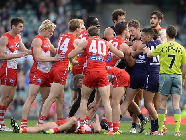 Sydney players remonstrate with Zac Dawson after his hit on Jake Lloyd. Picture: Daniel Wilkins