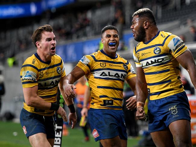 Maika Sivo of the Eels (right) celebrates after scoring a try during the Round 6 NRL match between the Sydney Roosters and the Parramatta Eels at Bankwest Stadium in Sydney, Saturday, June 20, 2020. (AAP Image/Dan Himbrechts) NO ARCHIVING, EDITORIAL USE ONLY