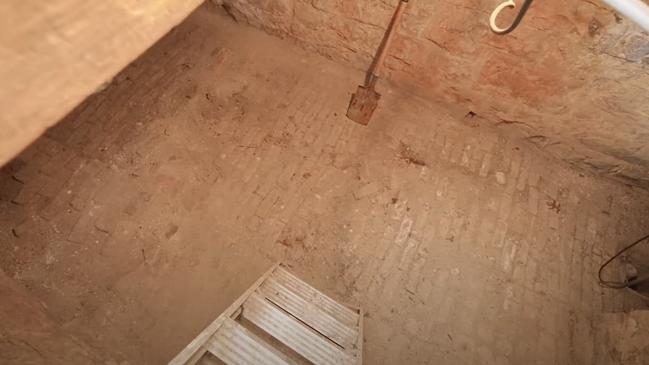 A basement cellar, accessed via the front living room, is hidden below a trapdoor.