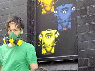 Barek (back) with his artwork and (front) Nathan Eyres, project manager of the Back Alley Gallery in Lismore.