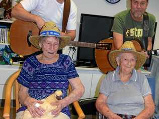 TOE-TAPPING: Dulcie Halsteed and Ev Jacobi put on their Tamworth Country Music hats when Brad Butcher and Brendan Radford paid the Biggenden Multi-Purpose Health Service a visit. Picture: Erica Murree