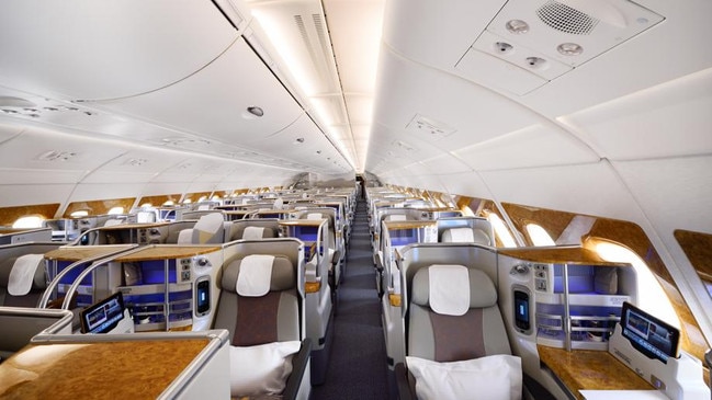 Some business class travellers are foregoing things like lounge access, in return for a slightly cheaper fare on airlines such as Emirates (pictured) and Qatar Airways.