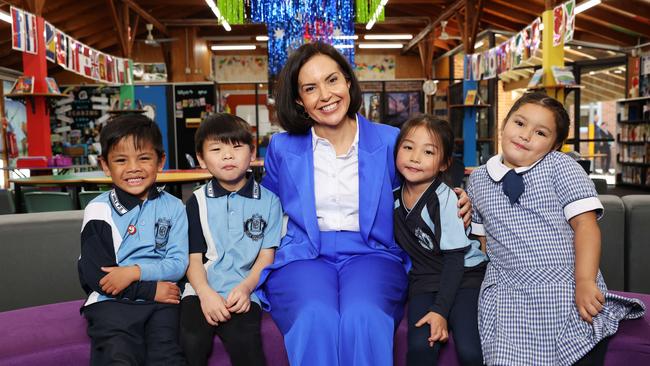 Education Minister Prue Car with Kindergarten students Izhaar So, Jackson Hang, Zoey Lo, 5 and Isabella Pollard. Canley Vale PS is one of the state's most linguistically diverse, with 98% of students from language backgrounds other than English. Picture: Rohan Kelly