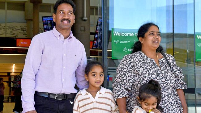 The Biloela Tamil asylum seeker family Tharnicaa and Kopika with mother Priya and father Nades Murugappan, at Brisbane Airport following their long-awaited trip back to Queensland and home to Biloela., Picture: John Gass