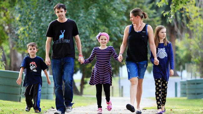 Dustin and Shannon Perry are fighting to save daughter Chloe (centre), who has brain cancer. Picture: Aaron Francis