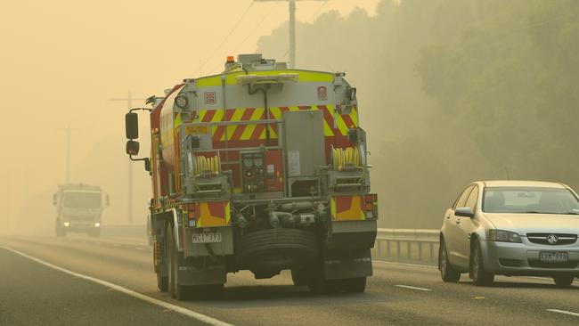 A fire truck is seen as people evacuate from Lakes Entrance prior to road closures. Picture: James Ross