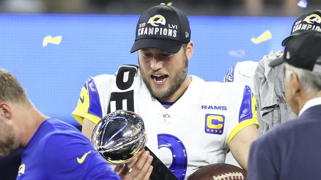 INGLEWOOD, CALIFORNIA - FEBRUARY 13: Matthew Stafford #9 of the Los Angeles Rams reacts as he holds the Vince Lombardi Trophy after the win against the Cincinnati Bengals following the NFL Super Bowl 56 football game at SoFi Stadium on February 13, 2022 in Inglewood, California. The Rams won 23-20. (Photo by Michael Owens/Getty Images)