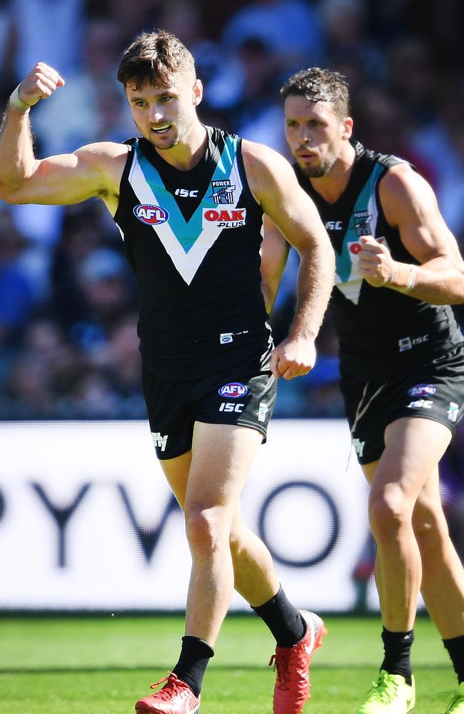 Sam Gray of Port Adelaide celebrates a goal with captain Travis Boak during the round three AFL match against Brisbane on Saturday. Picture Mark Brake/Getty Images