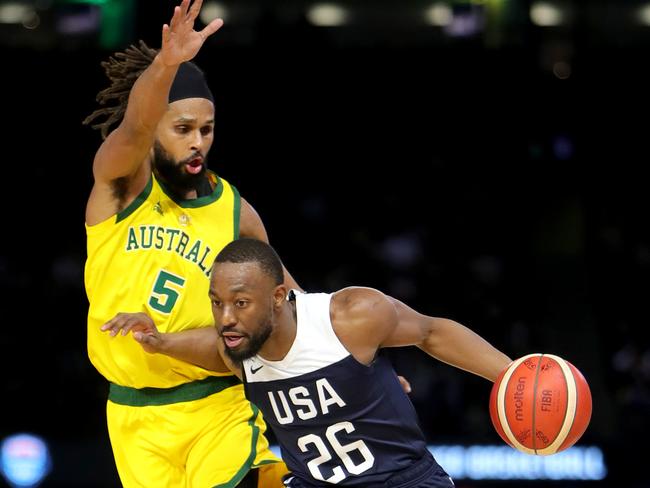 Boomers great Chris Anstey is a big fan on Team USA players such as Kemba Walker (seen here pushing away from the Boomers’ Patty Mills on Saturday night. Picture: Stuart McEvoy/The Australian