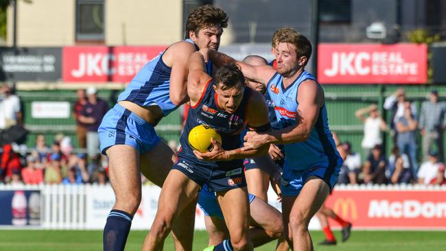 The pressure was intense from the outset. Here Norwood's Patrick Levicki is tackled by Thomas Read and John Greenslade. Picture: AAP Image/ Brenton Edwards