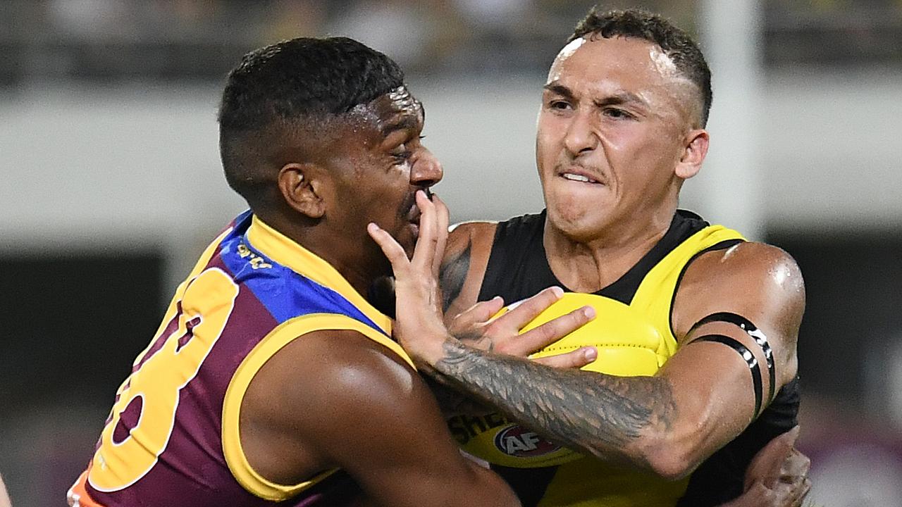 Keidean Coleman (left) tackles Richmond’s Shai Bolton at the Gabba. Picture: Quinn Rooney/Getty Images