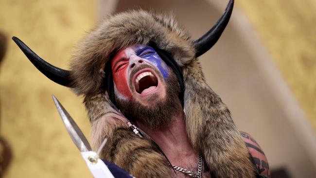 The QAnon Shaman screams "Freedom" inside the Senate chamber. Picture: Getty Images.