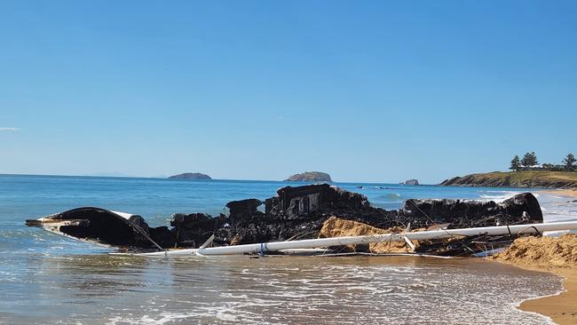 The burnt remains of the 15.2m yacht, Scoundrel, on Main Beach, Emu Park, on November 25, 2022. Photo: Darryn Nufer.