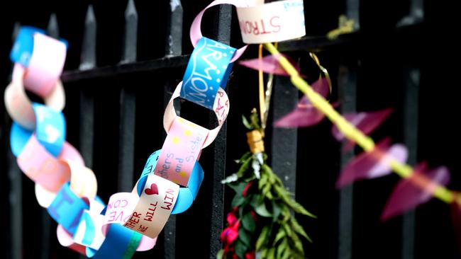 Tributes are seen hanging on the wall of the Christchurch Botanic Gardens. Picture: Hannah Peters/Getty