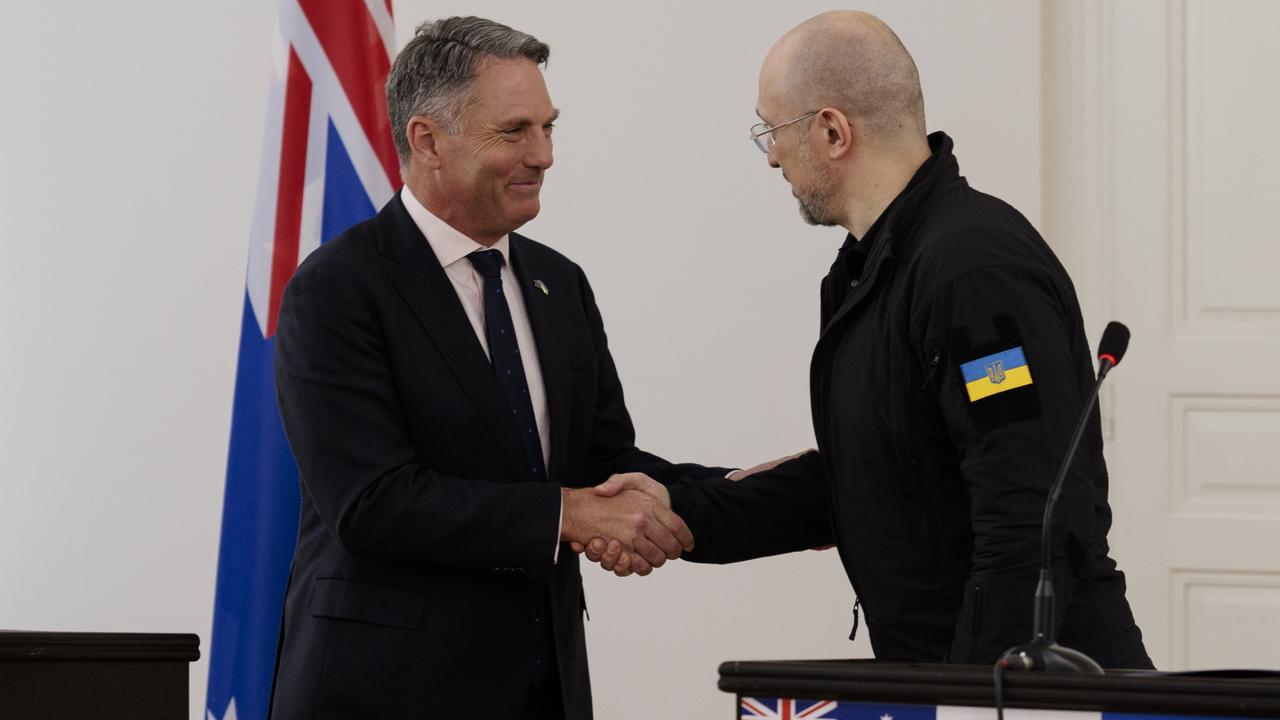 Mr Marles made the announcement after meeting with Ukrainian Prime Minister Denys Shmyhal, right, in Lviv.