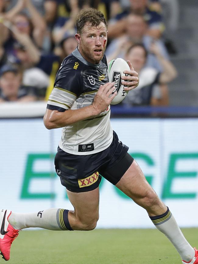 Gavin Cooper of the Cowboys crosses over to score a try during the Round One NRL match between North Queensland Cowboys and Brisbane Broncos at North Queensland Stadium in Townsville, Friday, March 13, 2020. (AAP Image/Cameron Laird)