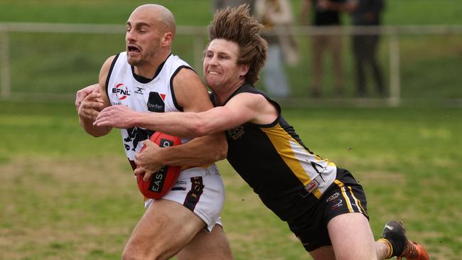 EFL: Jarryd Lowther of Doncaster East is chased down by Balwyn’s Charlie Haley. Photo: Hamish Blair