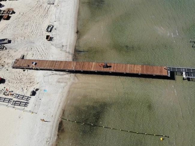 The new Altona Pier has begun to take shape in Port Phillip Bay with residents questioning whether it will be open in time for the Christmas break. Picture: Supplied