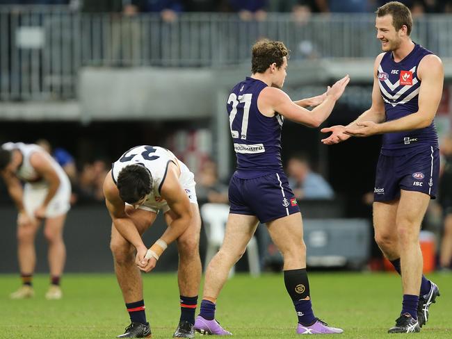 PERTH, AUSTRALIA - JUNE 10: Lachie Neale and Michael Apeness of the Dockers celebrate winning the round 12 AFL match between the Fremantle Dockers and the Adelaide Crows at Optus Stadium on June 10, 2018 in Perth, Australia.  (Photo by Paul Kane/Getty Images)