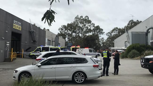 Police and emergency services on scene in Dingley Village where a 34-year-old Emily Liang died in an industrial accident.