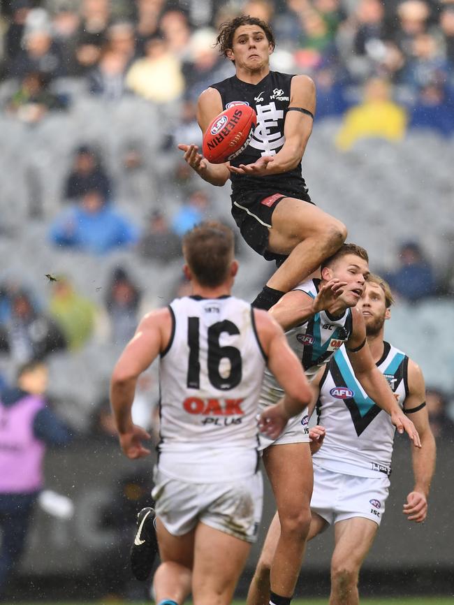 Carlton’s Charlie Curnow soars for a mark against the Power. Picture: AAP Image/Julian Smith