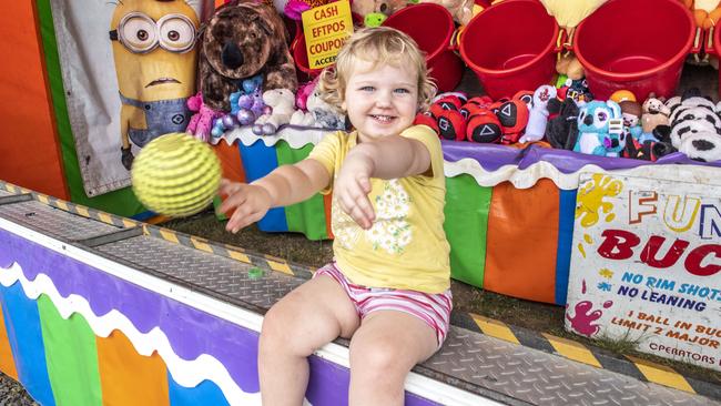 BALLS OF FUN: Isabelle Kampf 2yo tries out the family stand at the Toowoomba Royal Show. Thursday, March 24, 2022. Picture: Nev Madsen.