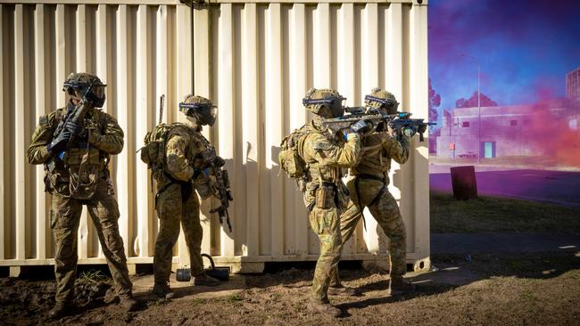 Australian army soldiers from the 3rd Battalion, Royal Australian Regiment, provide security during the conduct of an urban assault serial using the Blue Bolt non-lethal training ammunition, as part of the 2022 Duke of Gloucester Cup in Singleton. *** Local Caption *** Australian Army infantry soldiers from across Australia tested their core skills for the prestigious Duke of Gloucester Cup at the School of Infantry, near Singleton in NSW, July 31 - August 5 2022. The Duke of Gloucester Cup is the Armyâ€™s premier military skills competition, pitting the best Royal Australian Corps of Infantry rifle sections from each unit against one another through a series of challenging activities that test their core infantry skills, including marksmanship, tactics, teamwork and fitness. Along with the Duke of Gloucester Cup, five other trophies are awarded: Sir Arthur MacDonald Trophy for best foundation war-fighting skills; Gurkha Trophy for best live-fire shooting; Royal Ulster Rifles Trophy for best falling plate shooting; OSCMAR Trophy for best battle endurance; and the DSM Roche CSC Memorial Cup for best individual soldier. The Duke of Gloucester Cup was created by Prince Henry, Duke of Gloucester, in 1946, while serving as the Governor-General of Australia.