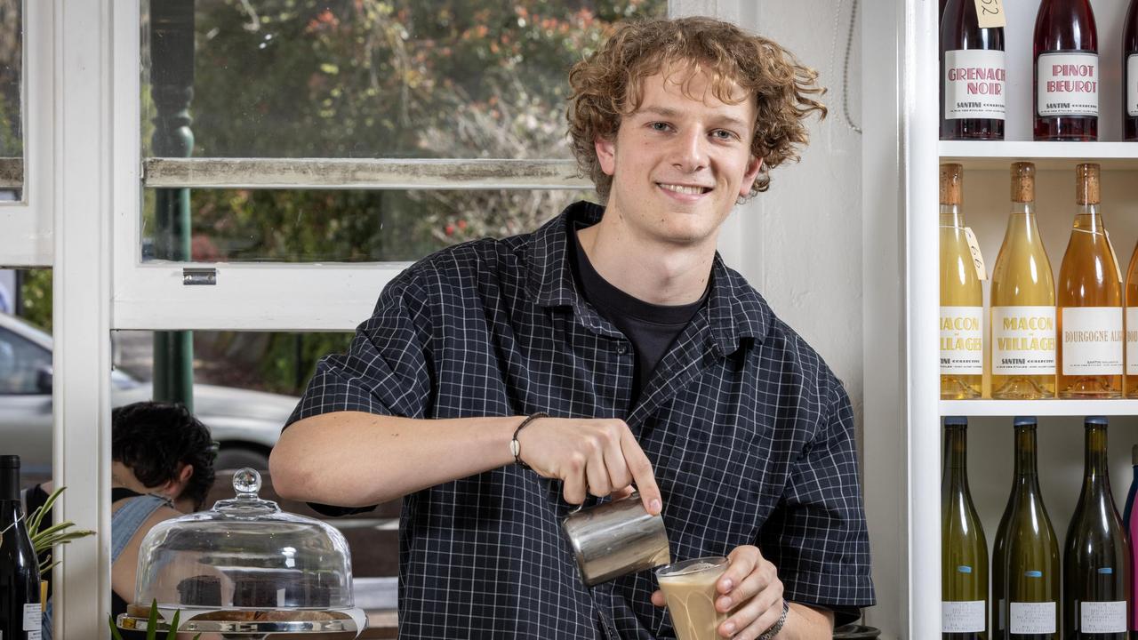 Tom Oswald serving customers and making coffee in his pop-up business Homeboy Cafe in Hahndorf, SA. Picture: Emma Brasier