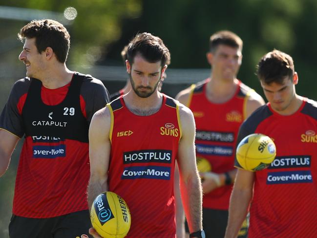 GOLD COAST, AUSTRALIA - JUNE 23: Jacob Heron, Chris Burgees and Corey Ellis during a Gold Coast Suns AFL training session at Metricon Stadium on June 23, 2020 in Gold Coast, Australia. (Photo by Chris Hyde/Getty Images)