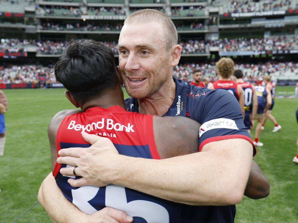 Simon Goodwin hugs Kysaiah Pickett after the win. Picture: Michael Klein
