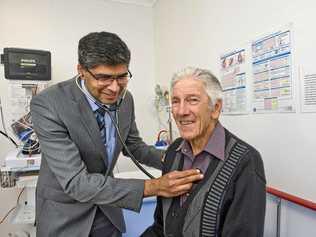 CARDIAC CARE: Interventional cardiologist Dr Harish Aikot checks over patient Noel Fogarty in the new Rapid Access Heart Centre at St Andrew's Hospital. Picture: Nev Madsen