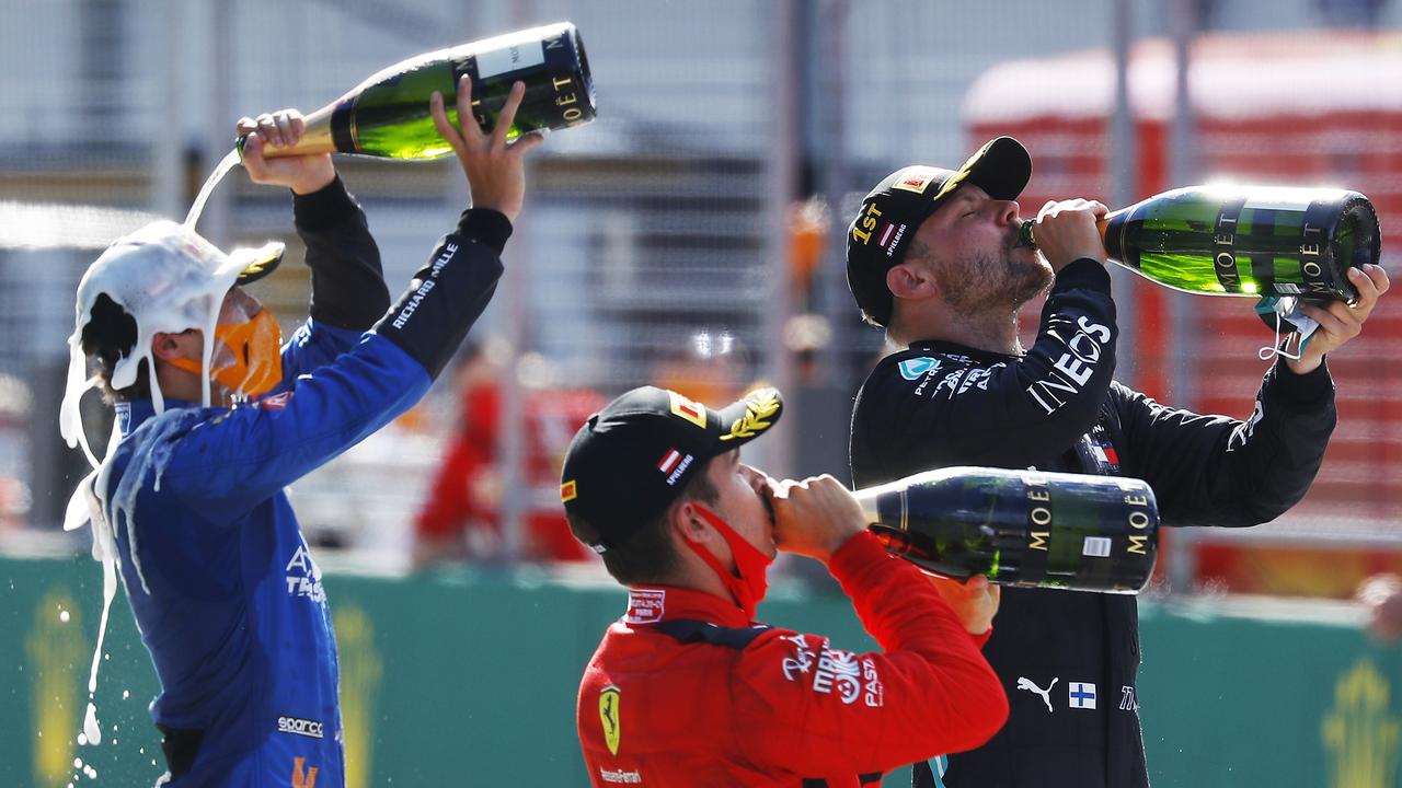 Lando Norris (left) is hoping we see a lot more of him celebrating on an F1 podium.