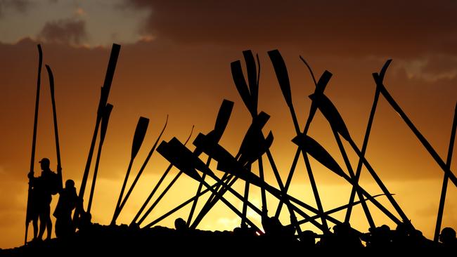 Last year: Club members hold oars for a symbolic burial at sea on April 25, 2023 in Currumbin, Australia. (Photo by Chris Hyde/Getty Images)