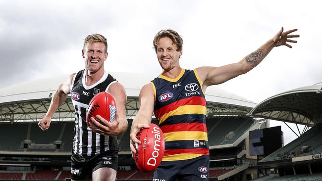 Port Adelaide skipper Tom Jonas and Adelaide Crows counterpart Rory Sloane could be playing before loyal fans at Adelaide Oval this season. Picture: Sarah Reed.