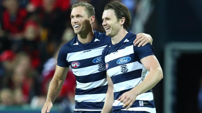 Joel Selwood and Patrick Dangerfield celebrate a goal.