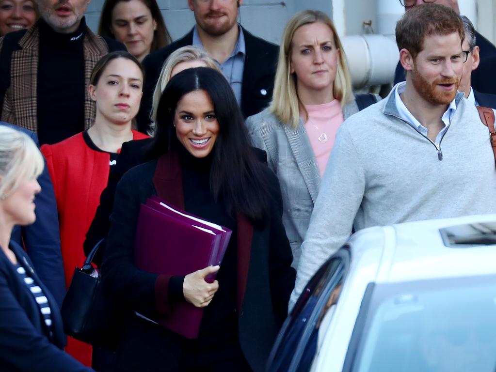 Meghan Markle has a stationery moment at Sydney airport.