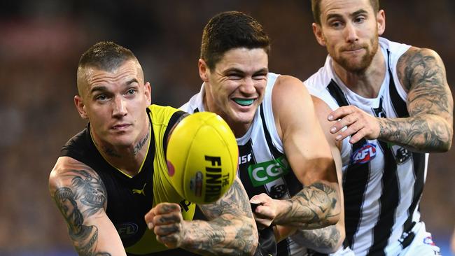 Dustin Martin handballs during the AFL preliminary final match last year against Collingwood. Picture: Quinn Rooney/Getty Images