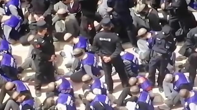 Drone footage shows blindfolded and shackled Uighurs in Xinjiang. Picture: YouTube