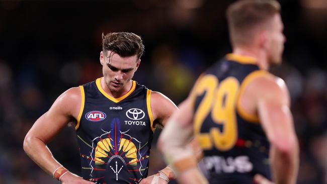 Ben Keays and Rory Laird after the final siren on Saturday. Picture: Sarah Reed/AFL Photos