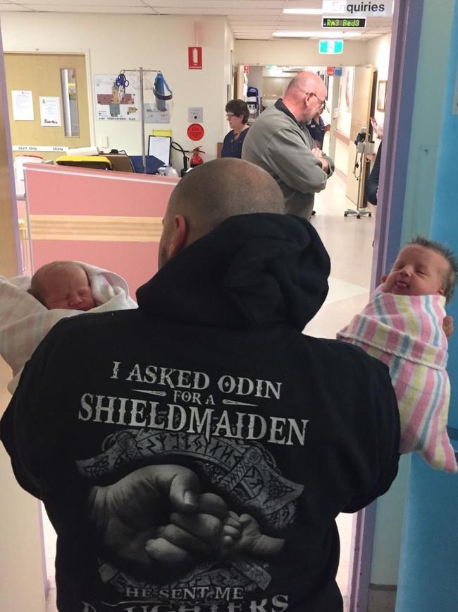 Mr Theoklis with his daughters in hospital shortly after they were born.