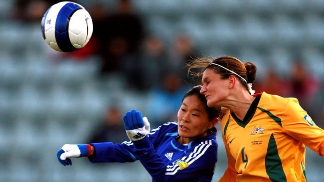 Di Alagich wins a header in the Asian Cup semi-final win over Japan, while carrying a broken nose and fractured wrist. Picture: Matt Turner