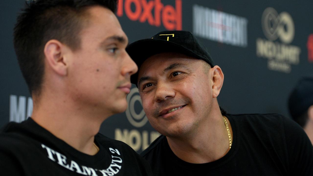 Australian boxing great Kostya Tszyu speaks to his son Tim at a press conference in 2019. (AAP Image/Dan Himbrechts)