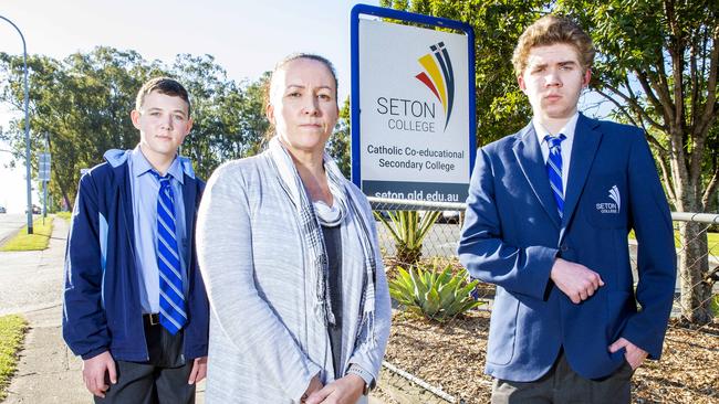 Parent Nicky Reed with 14-year-old Kyal and 16-year-old Tyler outside Seton College in Mt Gravatt East. Picture: Richard Walker