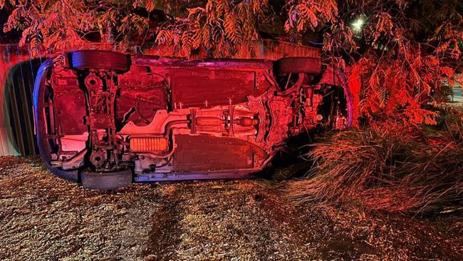 A car rolled at Glenelg North after the driver received an ill-timed kiss from her passenger. Picture: SAPOL