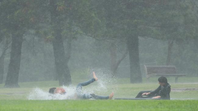 Kids having fun in the wild conditions at Mona Vale. Picture: John Grainger