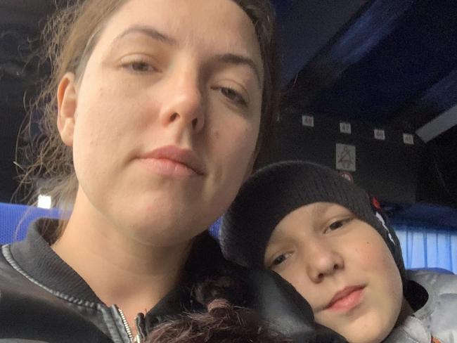 Yuliia Kuzma and Maxim on the bus from Kremenchuk to Warsaw. Their bus trip began with a siren. Picture: Contributed.