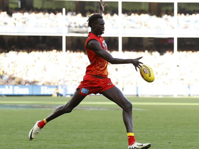 Mac Andrew of the Suns kicks the ball during the round 24 AFL match between Richmond Tigers and Gold Coast Suns at Melbourne Cricket Ground, on August 24, 2024, in Melbourne, Australia. Picture: Darrian Traynor/Getty Images.