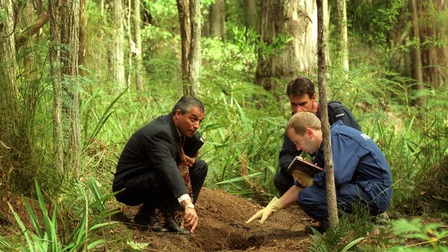 Police at the site where Wales buried Paul King and Margaret Wales-King in the Yarra Ranges National Park near Marysville.