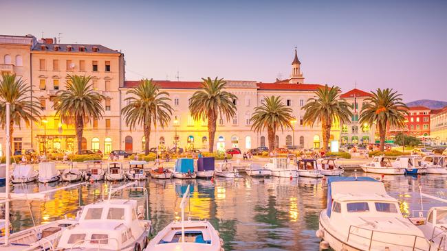 People enjoy the evening on the downtown waterfront in Split, Croatia.